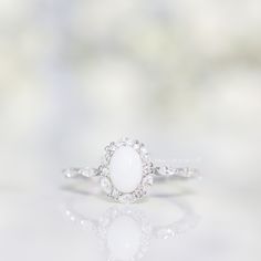 Vintage – Milk Couture Co. Timeless White Marquise Diamond Ring, Timeless Marquise White Diamond Ring, Delicate White Oval Diamond Ring, Delicate Oval White Diamond Ring, Elegant Flower Ring With Rose Cut Diamonds For Wedding, Elegant White Flower Ring, Elegant Flower Ring With Halo Design For Anniversary, White Marquise Diamond Ring With Gemstone, Oval Diamond White Moonstone Ring For Wedding