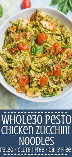 a bowl filled with pasta and vegetables on top of a blue table cloth next to tomatoes