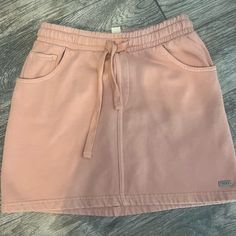 Roxy Tie Mini Skirt Light Pink / Coral Xs Missing Tag But Never Worn. Still Has Plastic Cotton Casual Pink Mini Skirt With Pockets, Casual Short Mini Skirt, Casual Pink Cotton Skirt, Casual Short Pleated Skirt, Casual Pink Mini Skirt, Casual Short Cotton Skirt, Pink Cotton Skort With Elastic Waistband, Casual Short Skirt, Pink Coral