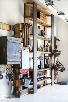 a room filled with lots of different types of tools and items on wooden shelving