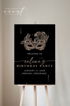 a black and gold birthday party sign sitting on top of a easel