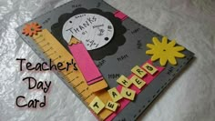 a teacher's day card with a ruler and flowers