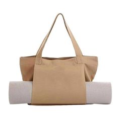 an image of a woman's handbag and yoga mat