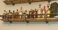 a shelf filled with lots of liquor bottles