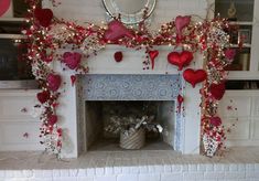 a fire place decorated with hearts and flowers