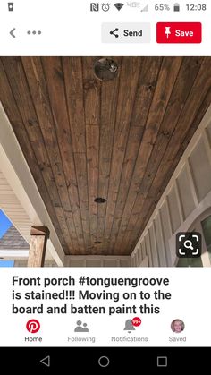 the front porch is being decorated with wood planks and has been installed on the ceiling