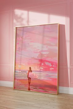 a pink painting with a woman holding a surfboard in front of it on the wall