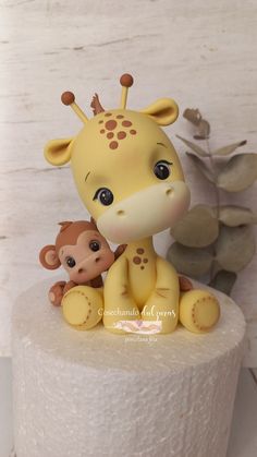 a cake with a giraffe and monkey on it