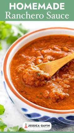 homemade ranchero sauce in a bowl with a wooden spoon