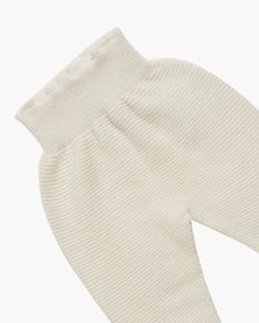 Our Evie Baby Leggings are a luxe addition to any baby's wardrobe. Delicately crafted from a cashmere and wool blend, these stylish trousers are designed with comfort. The footed design ensures little toes stay warm and the elasticated waistband provides a snug fit. The ribbing at the ankle ensures a comfortable stretch and a perfect fit. Pair with the matching cream cardigan for a complete look. Baby Boy Shirts, Girls Special Occasion Dresses, Hand Smock, Cream Cardigan, Baby Leggings, Christening Gowns, Boys Shirts, Clothes Gift