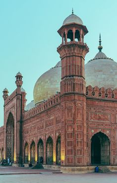 a large building with two towers and domes