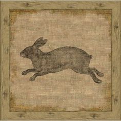 the silhouette of a rabbit is shown in an old fashioned wooden frame on burliege paper