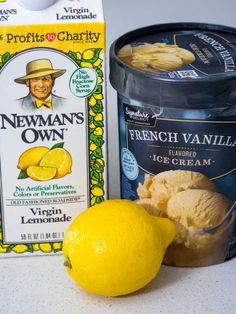 two lemons and ice cream next to a carton of newnan's own