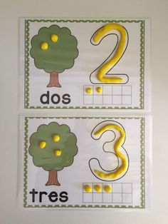 two posters with numbers and trees on them