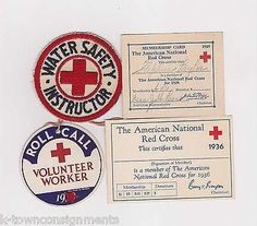 three red cross volunteer patches, one for volunteer worker and the other for volunteer worker