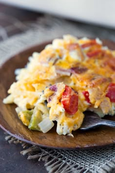 a close up of a plate of food with broccoli and cheese on it