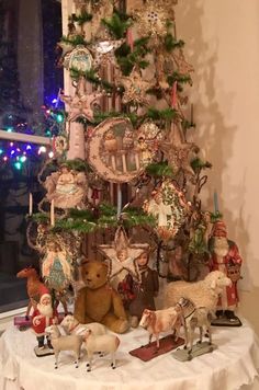 a christmas tree decorated with ornaments and animals