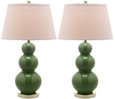 two green lamps sitting next to each other on top of a white table lamp shade