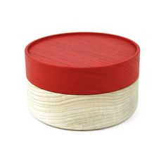 a red and white wooden box on a white background