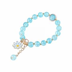 a bracelet with blue beads and a flower on it