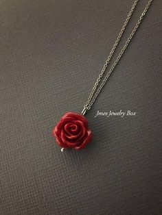 Dark red rose necklace. Red rose is on a delicate but sturdy 18'' stainless steel chain with lobster clasp. If you choose to add initials, please leave the initials in order left to right in the note to sellers box during checkout. *Necklace is available with 1,2 and 3 leaves *15mm Resin rose *Silver plated brass leaves *Stainless steel chain *Handmade with love <3 Like Jmesjewelrybox on Facebook for updates on new jewelry, upcoming sales and giveaways! Plus Facebook fans save 5% :D Find the Rose Sterling Silver Jewelry For Valentine's Day, Valentine's Day Flower Pendant Jewelry With Rose Design, Valentine's Day Rose Design Flower Pendant Jewelry, Red Flower Pendant Jewelry For Valentine's Day, Rose Nickel Free Jewelry For Gift, Rose-colored Nickel-free Jewelry For Gifts, Rose Nickel-free Jewelry For Gift, Dainty Rose Jewelry For Valentine's Day, Minimalist Rose Design Jewelry For Gift