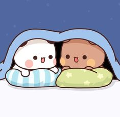 two cute little animals laying in bed under the covers