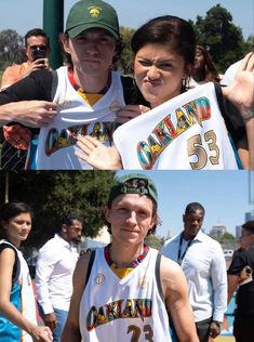 two photos of people holding up shirts and posing for the camera with other people behind them