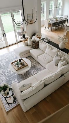 a large white sectional couch in a living room