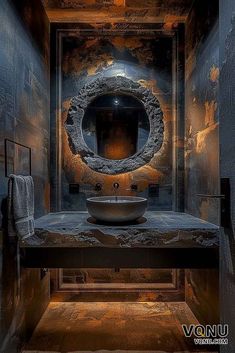 a bathroom with a sink, mirror and stone counter top in the middle of it