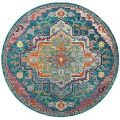 a round rug with an ornate design in blue, orange and pink colors on it