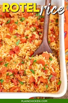 a casserole dish filled with rice and tomatoes, topped with parsley on the side