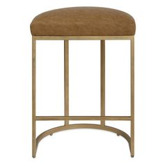 the backless stool is made from metal and has a tan leather seat pad on it