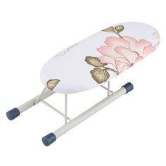 an ironing board with flowers on it