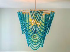 a blue chandelier hanging from the ceiling