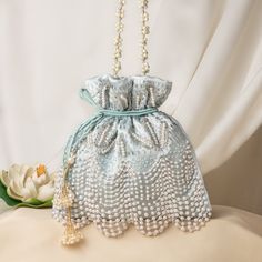 "Fancy Pearl Bead Embroidery Satin Wedding Purse Bag for Woman | Bridal Sky-Blue Purse Handbag | Fashionable Drawstring Pouch Purse Potli Bag Package Contents: 1 Size: 10\" x 8\" Designed with the heart, this beautiful Potli or batawa bag are eye catchy and made of premium material. Key Features: Embroidery art work. (zardosi work). This potli is good match with both Indian and western outfits and are superb for wedding and festive parties. This would be best complement to your designer saree, lenhga or any other kind of dress. This is the combination of traditional and modern embroidery work. This is enough to keep your accessories and all needed essentials and it can be a best gift for any woman." Embellished Pouch Bag For Reception, Festive Bag With Pearl Embroidery For Reception, Embroidered Pouch For Reception, Silver Embroidered Clutch Bag, Beaded Rectangular Bag For Reception, Silver Embroidered Bag For Gift, Rectangular Beaded Bag For Reception, Silver Embroidered Bags Suitable For Gifts, Embellished Pouch Shoulder Bag For Reception