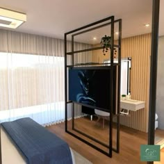 a room with a bed, television and mirror in it's centerpieces