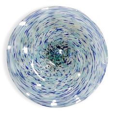 a blue and white bowl sitting on top of a table