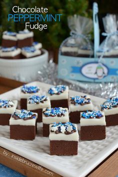 chocolate peppermint fudge brownies on a white plate with blue and white sprinkles