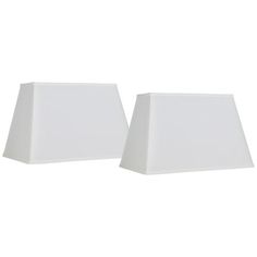 two white lamps sitting next to each other