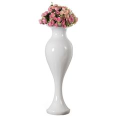 a white vase with pink flowers in it