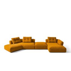 an orange sectional sofa with pillows on it's back and side, in front of a white background