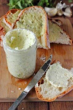 bread and butter on a cutting board with a knife