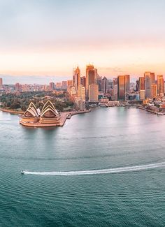 an aerial view of the sydney opera house and cityscape in the foreground