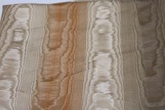 an orange and brown striped fabric with white stripes