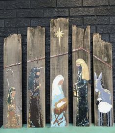 the wooden nativity scene has been painted on