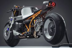 an unusual motorcycle is shown with wheels and lights on the front wheel, as well as its rear tire