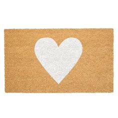 a door mat with a white heart on it