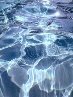 the water is very clear and there are no waves or ripples to see in this photo