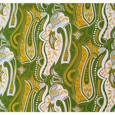 green and yellow abstract pattern with white, gold, and black details on the fabric