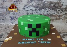 a birthday cake made to look like the creeper from minecraft